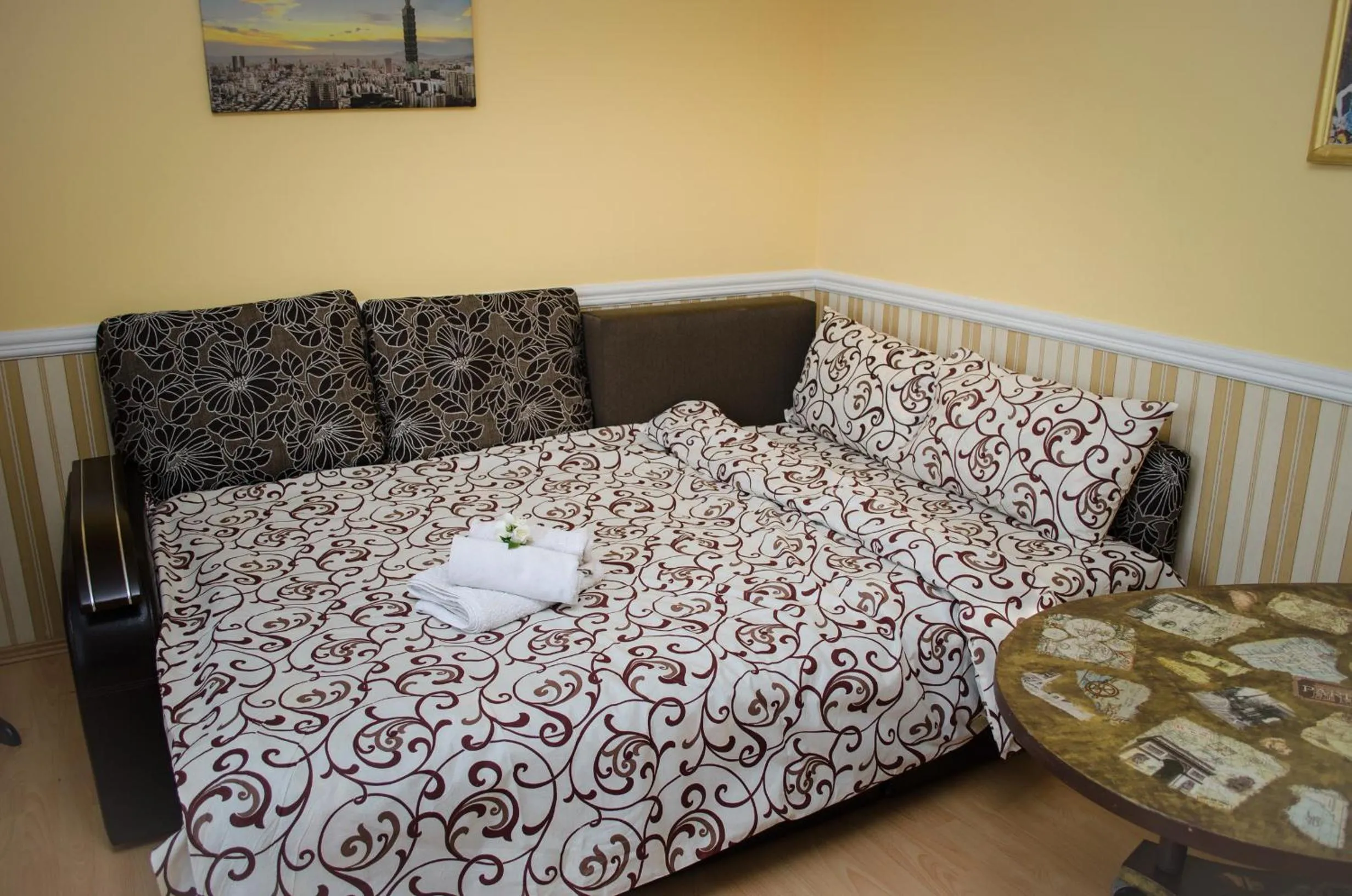 Seating area, Bed in Babylon Apartments