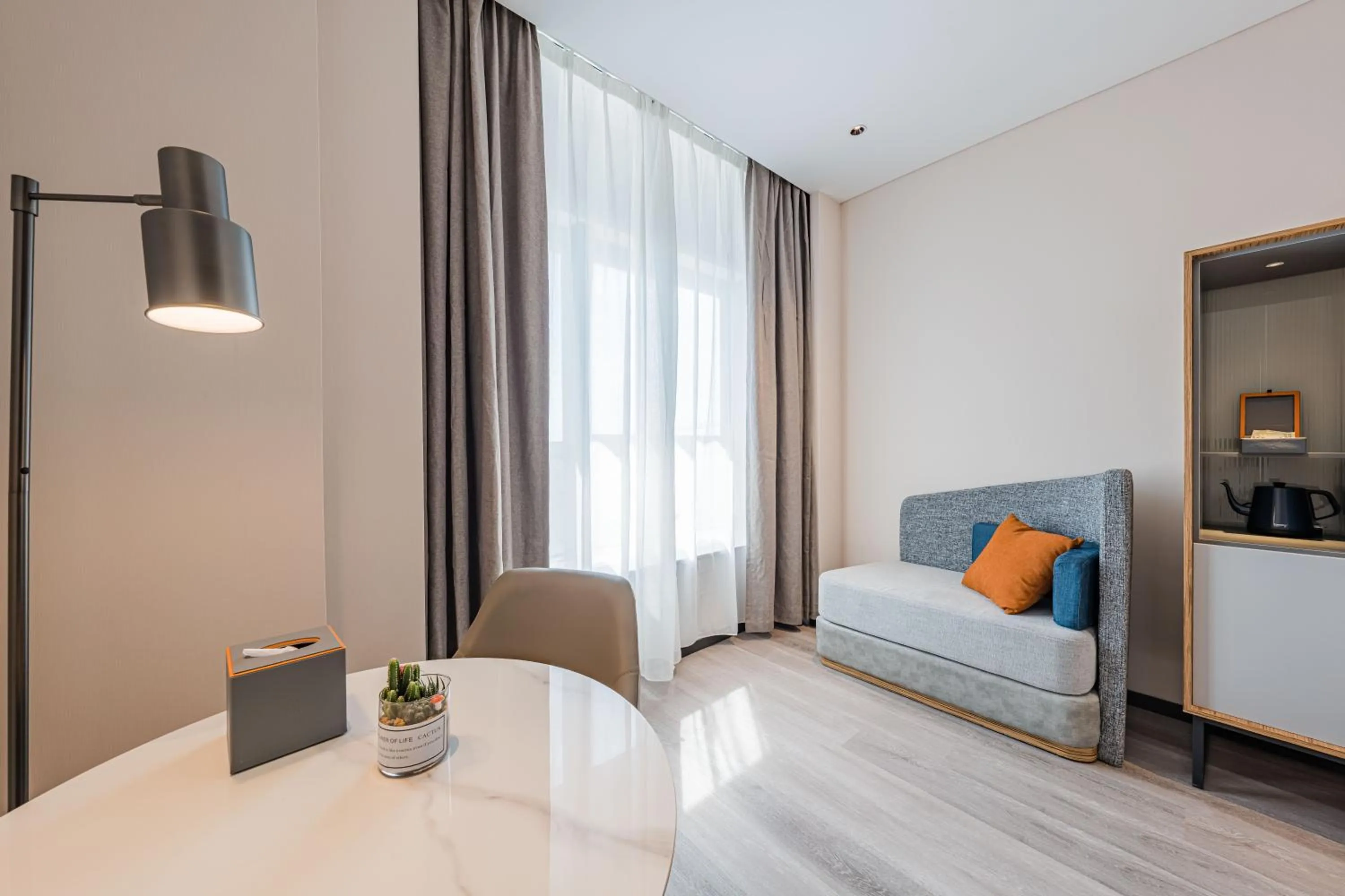 Seating area, Bed in UrCove by HYATT Hangzhou Riverside CBD