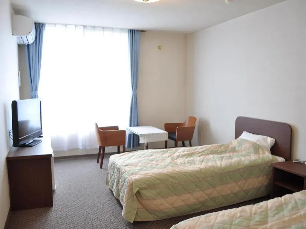 Bed in Ryobou Hanaemi Hotel Bed in Ryobou Hanaemi Hotel