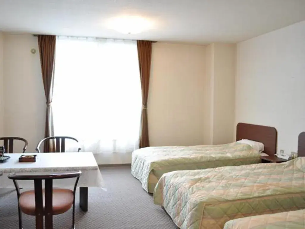 Bed in Ryobou Hanaemi Hotel Bed in Ryobou Hanaemi Hotel