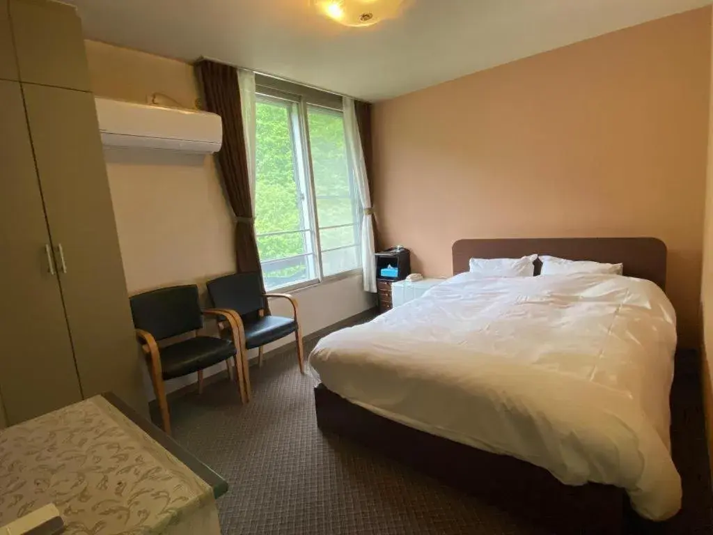 Bed in Ryobou Hanaemi Hotel Bed in Ryobou Hanaemi Hotel