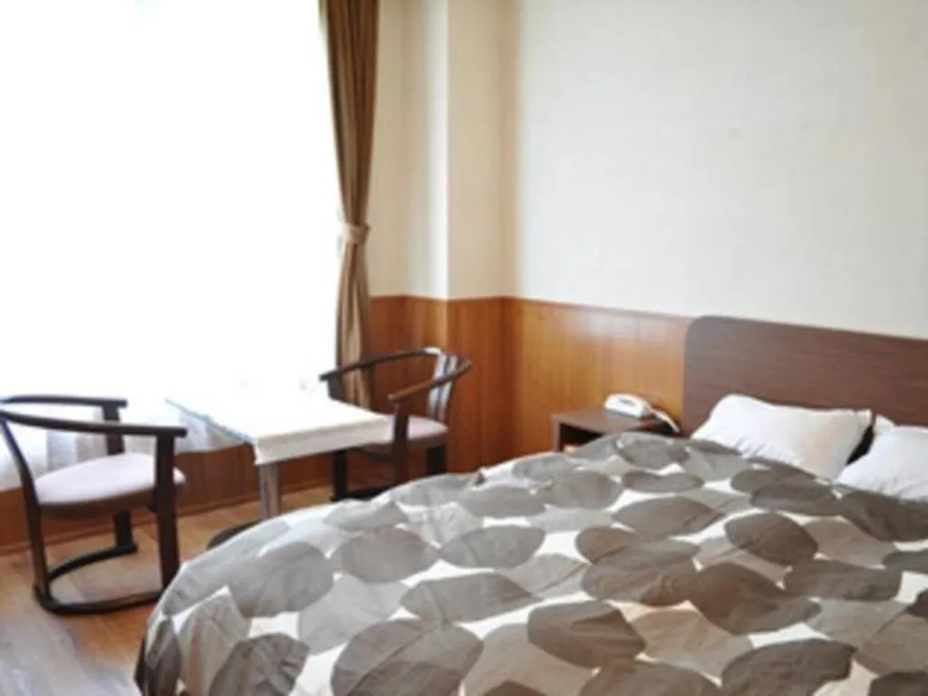 Bed in Ryobou Hanaemi Hotel