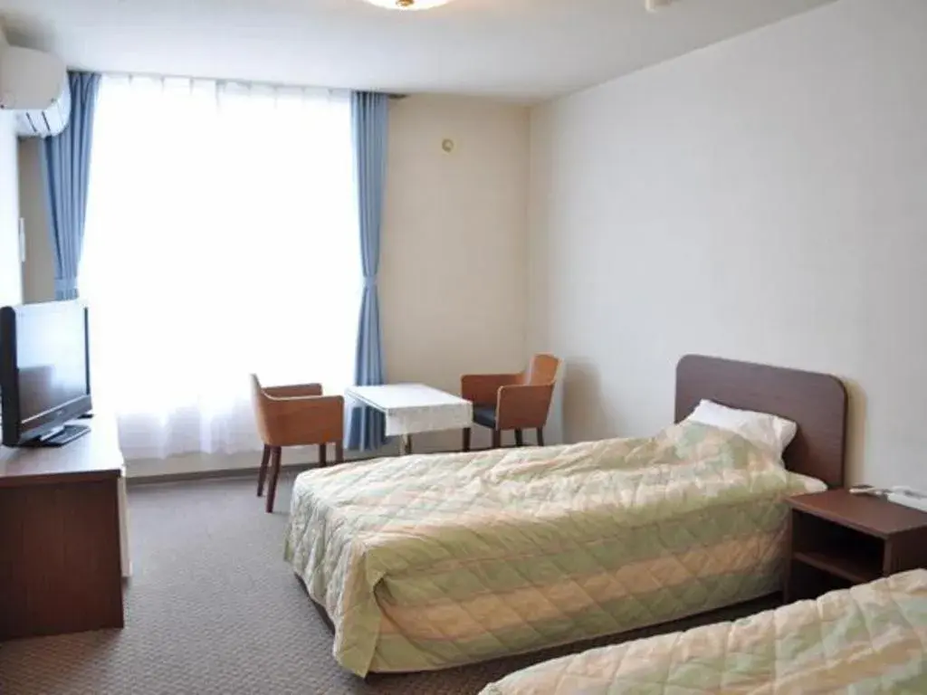 Bed in Ryobou Hanaemi Hotel Bed in Ryobou Hanaemi Hotel