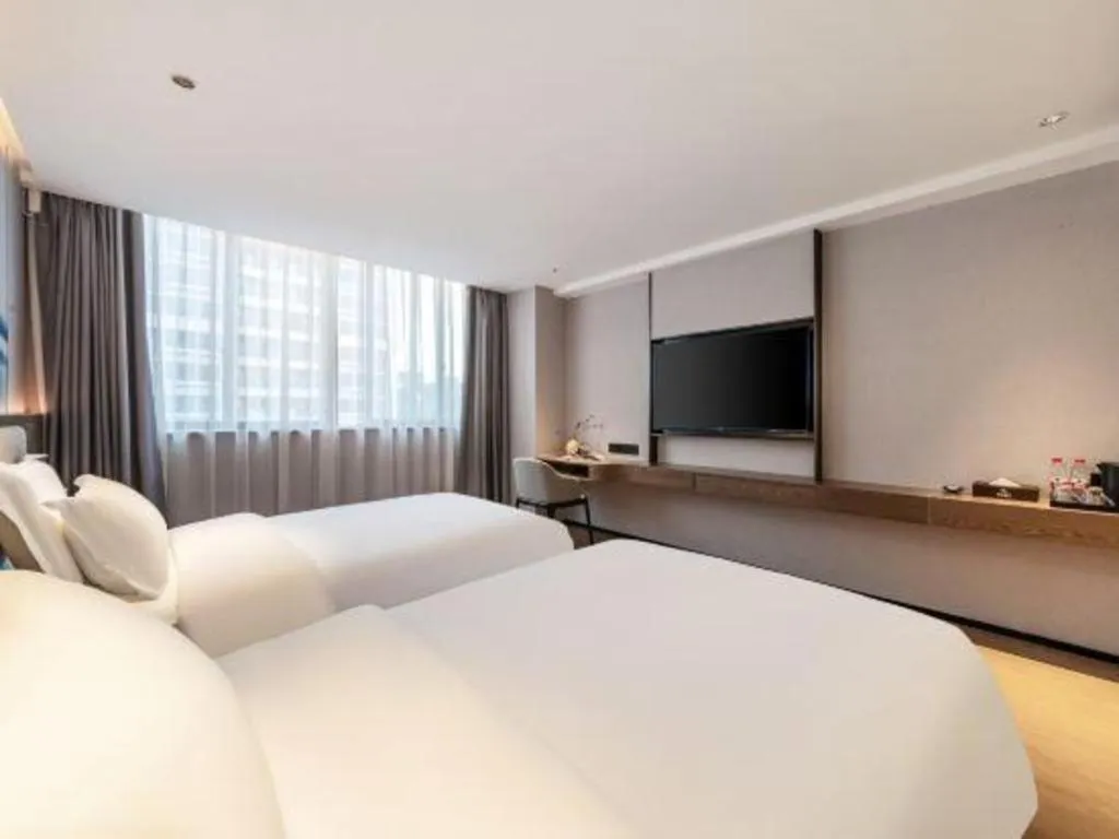 Bed in Yian Business Hotel