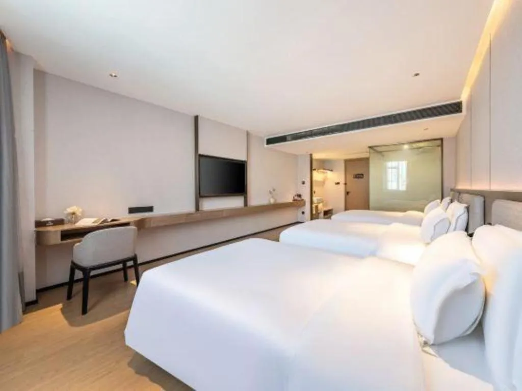 Bed in Yian Business Hotel
