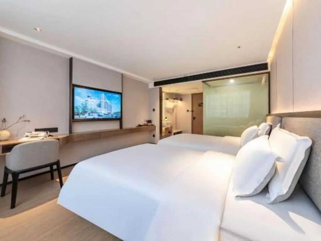 Bed in Yian Business Hotel