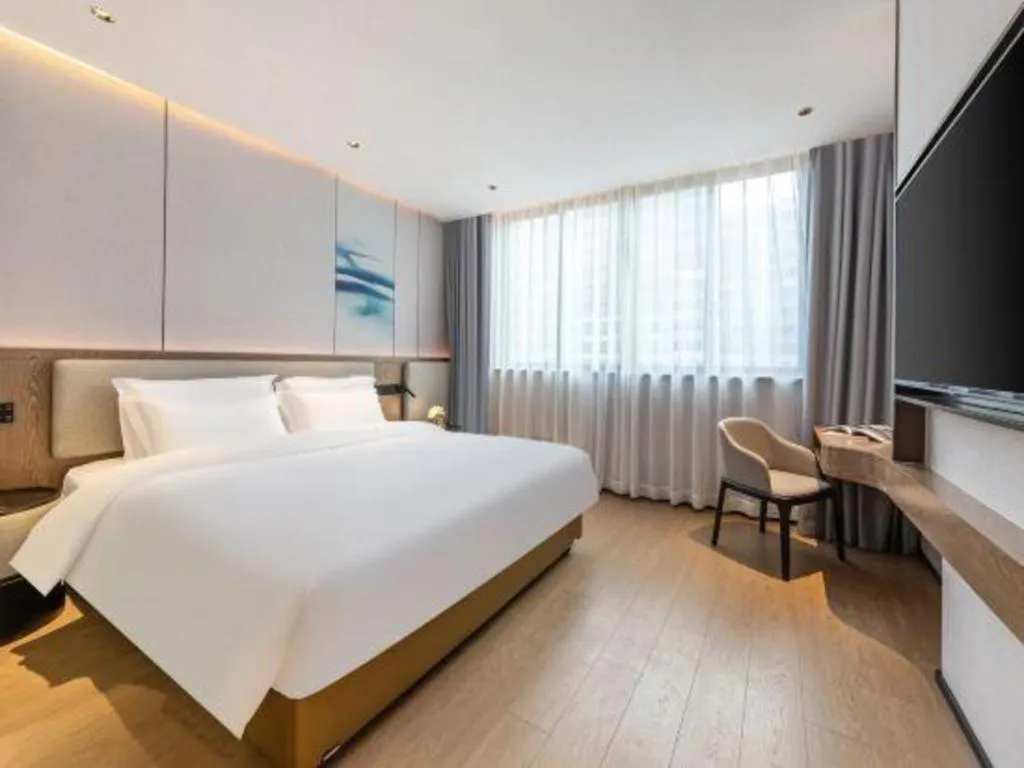 Bed in Yian Business Hotel