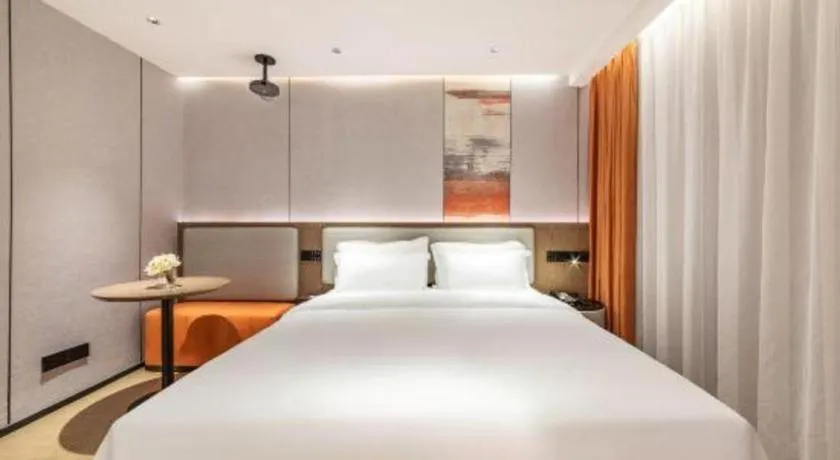 Bed in Yian Business Hotel