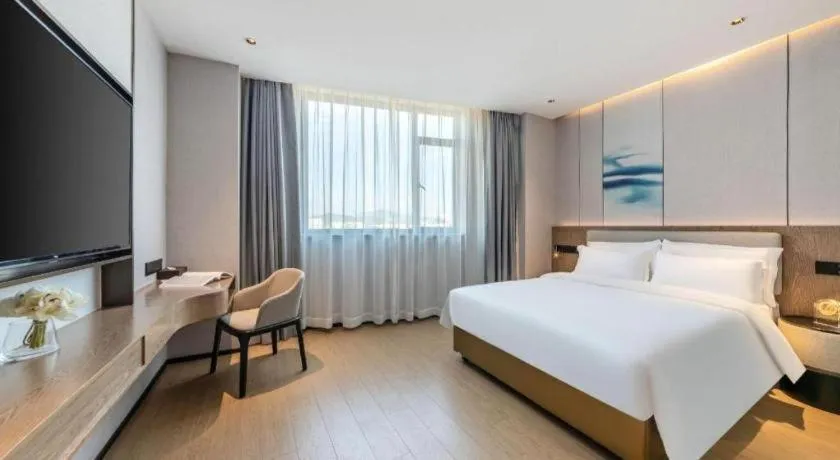 Bed in Yian Business Hotel