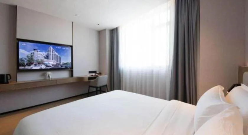 Bed in Yian Business Hotel