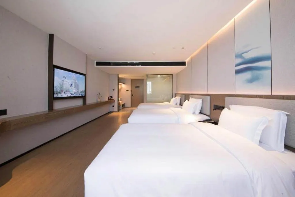 Bed in Yian Business Hotel