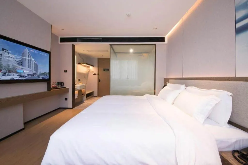Bed in Yian Business Hotel