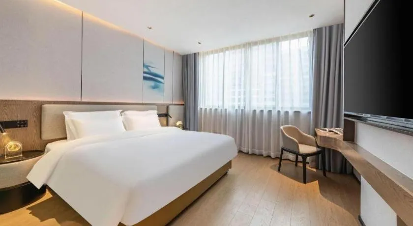 Bed in Yian Business Hotel