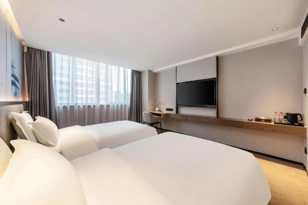 Bed in Yian Business Hotel