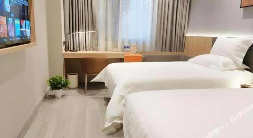 Bed in Jinjiang Inn Wuxi Liangqing Road Wanda Plaza Yunhe Bay Industrial Center