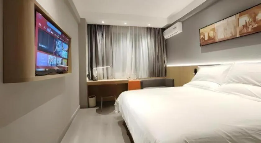 Bed in Jinjiang Inn Wuxi Liangqing Road Wanda Plaza Yunhe Bay Industrial Center