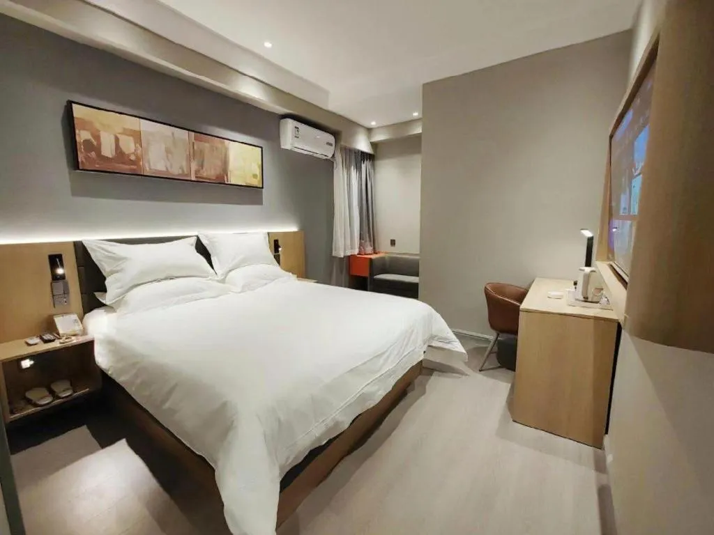 Bed in Jinjiang Inn Wuxi Liangqing Road Wanda Plaza Yunhe Bay Industrial Center