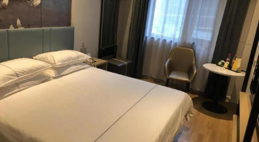 Bed in Jinjiang Inn Wuxi Liangqing Road Wanda Plaza Yunhe Bay Industrial Center