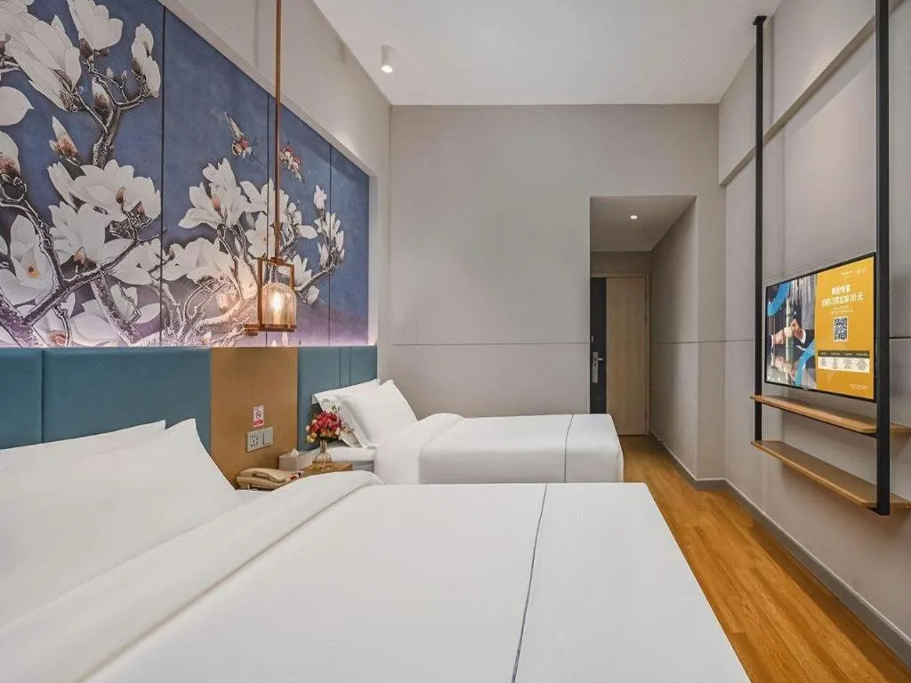 Bed in Jinjiang Inn Wuxi Liangqing Road Wanda Plaza Yunhe Bay Industrial Center