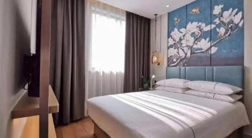 Bed in Jinjiang Inn Wuxi Liangqing Road Wanda Plaza Yunhe Bay Industrial Center