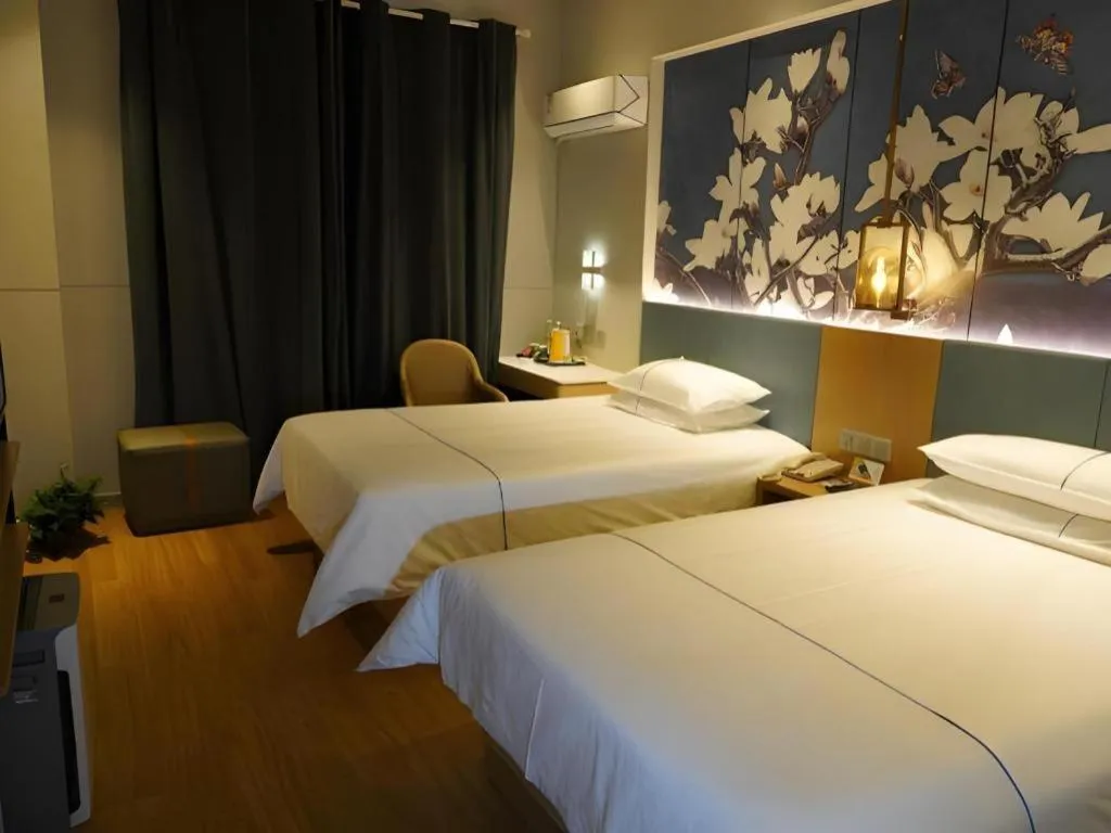 Bed in Jinjiang Inn Wuxi Liangqing Road Wanda Plaza Yunhe Bay Industrial Center