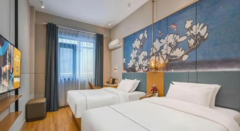 Bed in Jinjiang Inn Wuxi Liangqing Road Wanda Plaza Yunhe Bay Industrial Center