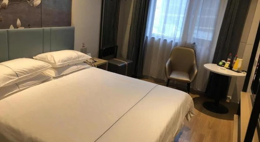 Bed in Jinjiang Inn Wuxi Liangqing Road Wanda Plaza Yunhe Bay Industrial Center