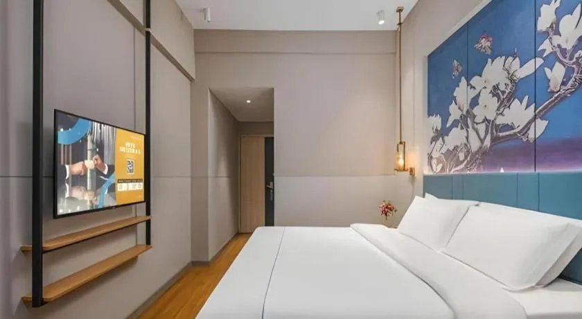 Bed in Jinjiang Inn Wuxi Liangqing Road Wanda Plaza Yunhe Bay Industrial Center