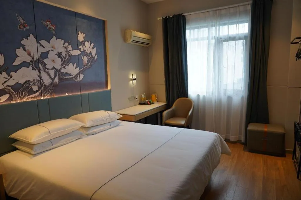Bed in Jinjiang Inn Wuxi Liangqing Road Wanda Plaza Yunhe Bay Industrial Center