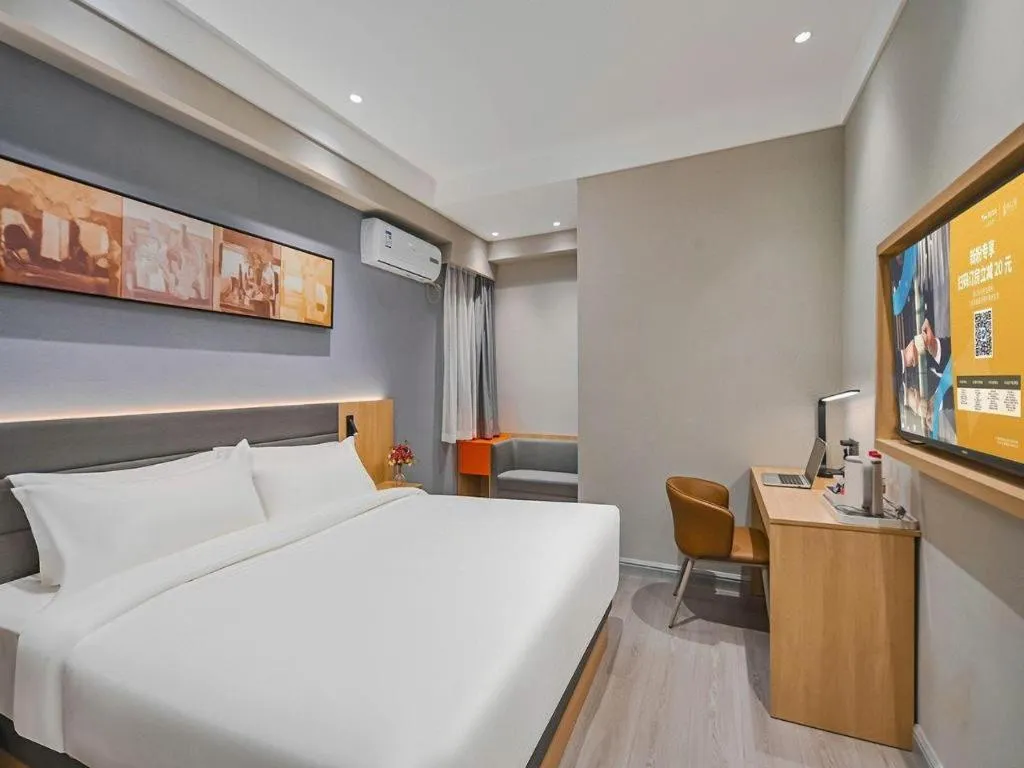 Bed in Jinjiang Inn Wuxi Liangqing Road Wanda Plaza Yunhe Bay Industrial Center