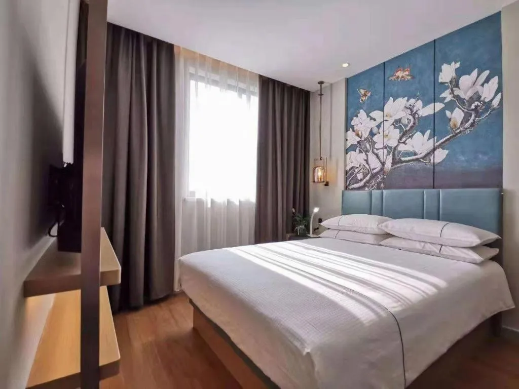 Bed in Jinjiang Inn Wuxi Liangqing Road Wanda Plaza Yunhe Bay Industrial Center