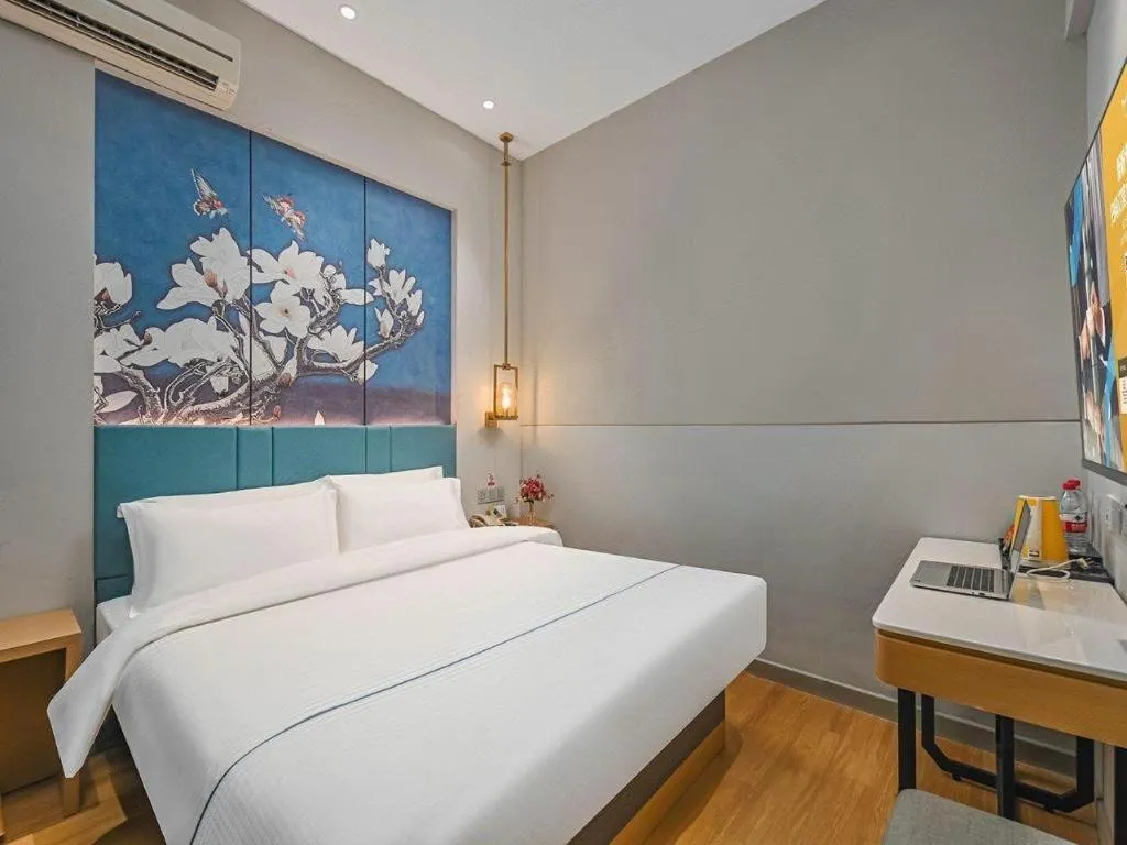 Bed in Jinjiang Inn Wuxi Liangqing Road Wanda Plaza Yunhe Bay Industrial Center