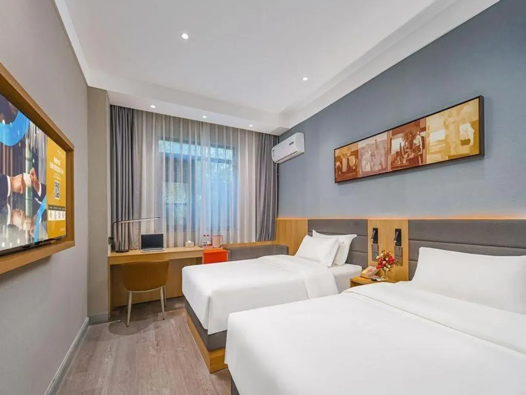 Bed in Jinjiang Inn Wuxi Liangqing Road Wanda Plaza Yunhe Bay Industrial Center