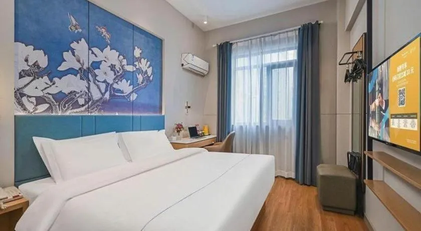 Bed in Jinjiang Inn Wuxi Liangqing Road Wanda Plaza Yunhe Bay Industrial Center