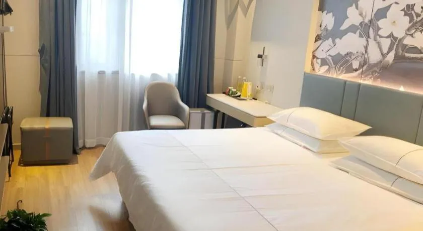 Bed in Jinjiang Inn Wuxi Liangqing Road Wanda Plaza Yunhe Bay Industrial Center
