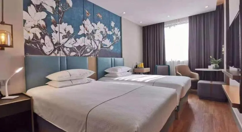 Bed in Jinjiang Inn Wuxi Liangqing Road Wanda Plaza Yunhe Bay Industrial Center