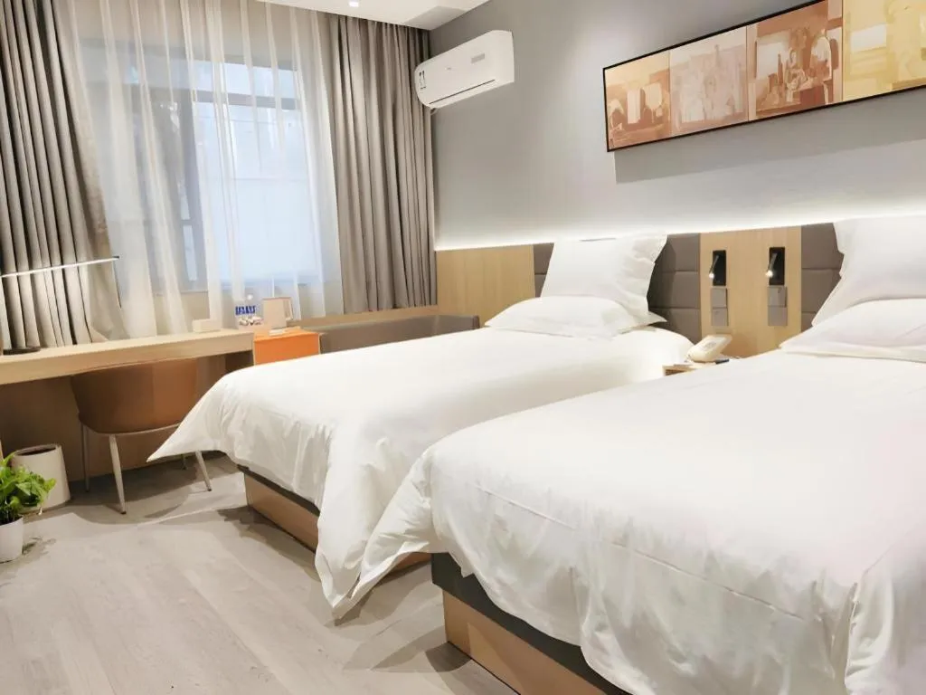Bed in Jinjiang Inn Wuxi Liangqing Road Wanda Plaza Yunhe Bay Industrial Center