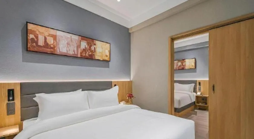 Bed in Jinjiang Inn Wuxi Liangqing Road Wanda Plaza Yunhe Bay Industrial Center