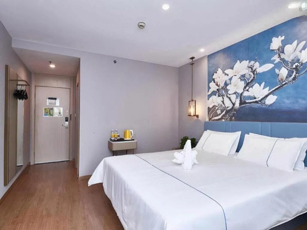 Bed in Jinjiang Inn Wuxi Liangqing Road Wanda Plaza Yunhe Bay Industrial Center