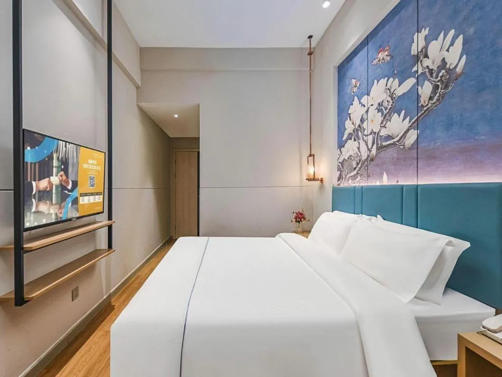 Bed in Jinjiang Inn Wuxi Liangqing Road Wanda Plaza Yunhe Bay Industrial Center