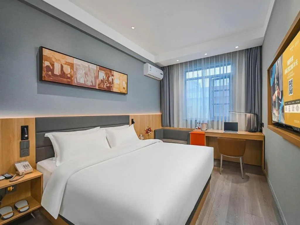Bed in Jinjiang Inn Wuxi Liangqing Road Wanda Plaza Yunhe Bay Industrial Center