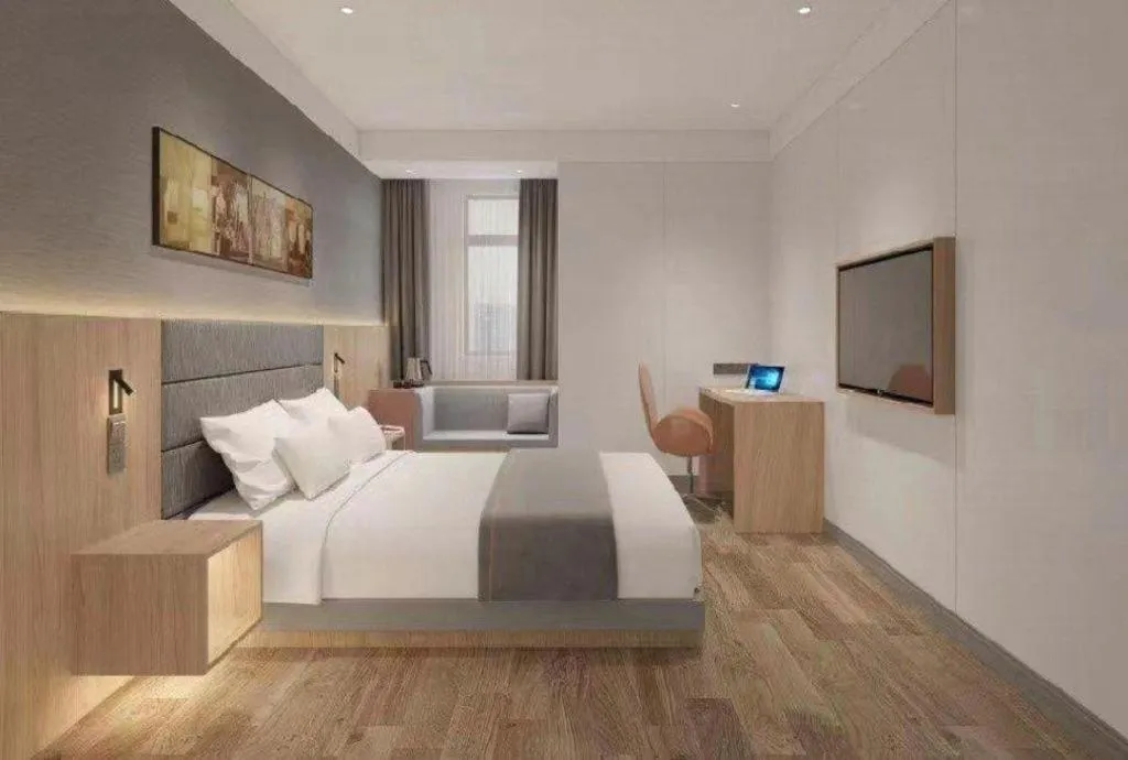 Bed in Jinjiang Inn Wuxi Liangqing Road Wanda Plaza Yunhe Bay Industrial Center