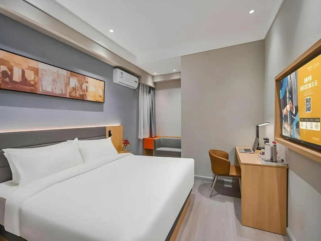 Bed in Jinjiang Inn Wuxi Liangqing Road Wanda Plaza Yunhe Bay Industrial Center
