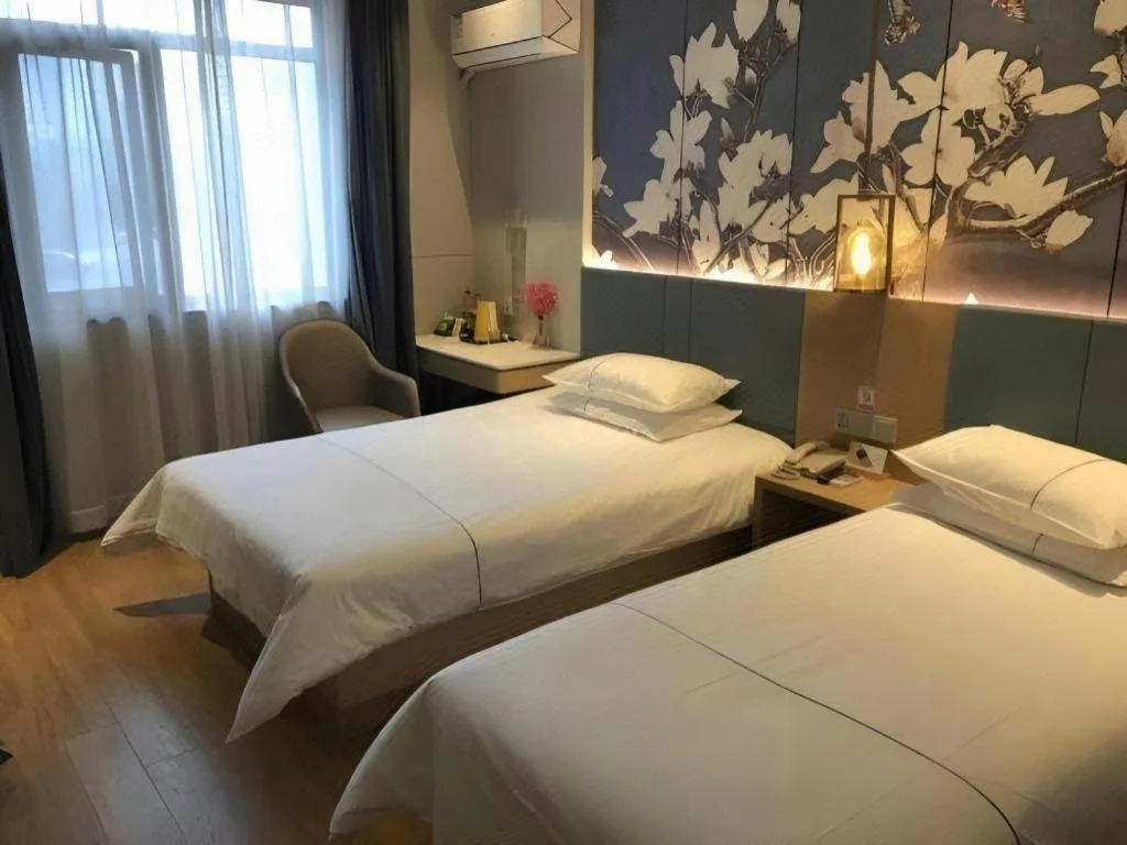 Bed in Jinjiang Inn Wuxi Liangqing Road Wanda Plaza Yunhe Bay Industrial Center