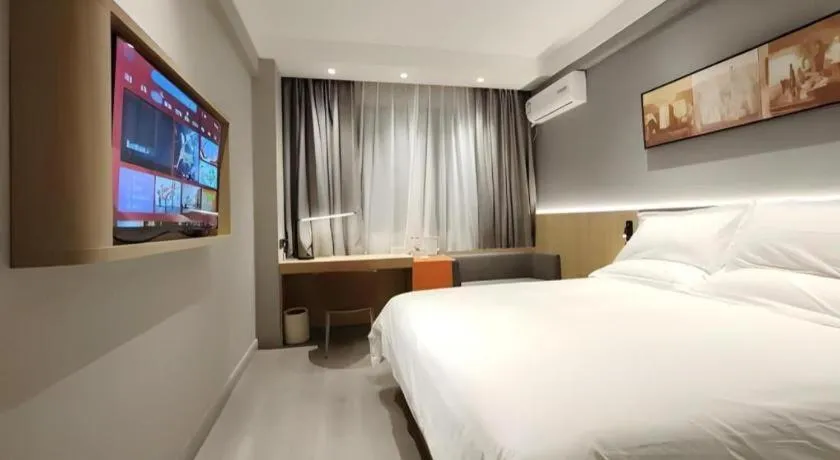 Bed in Jinjiang Inn Wuxi Liangqing Road Wanda Plaza Yunhe Bay Industrial Center