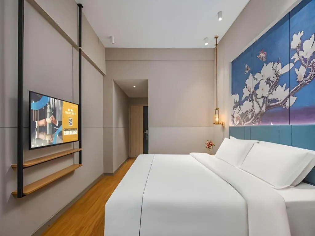 Bed in Jinjiang Inn Wuxi Liangqing Road Wanda Plaza Yunhe Bay Industrial Center