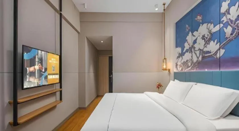 Bed in Jinjiang Inn Wuxi Liangqing Road Wanda Plaza Yunhe Bay Industrial Center