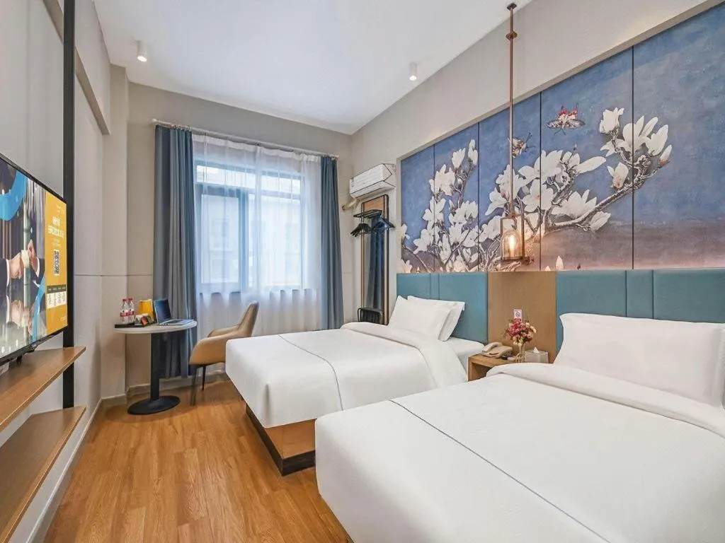 Bed in Jinjiang Inn Wuxi Liangqing Road Wanda Plaza Yunhe Bay Industrial Center