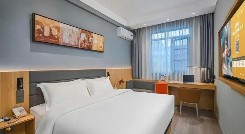 Bed in Jinjiang Inn Wuxi Liangqing Road Wanda Plaza Yunhe Bay Industrial Center