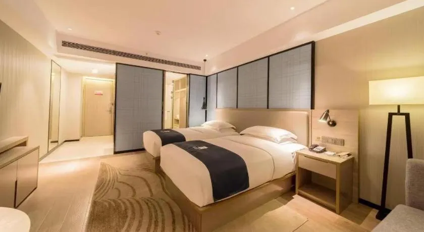 Bed in Echarm Hotel Wuhan Changjiang New District Gaoche Metro Station